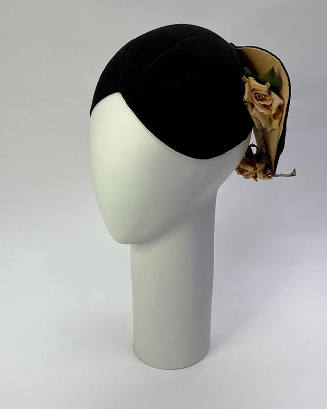 Black helmet hat cut to form projecting flanges in back