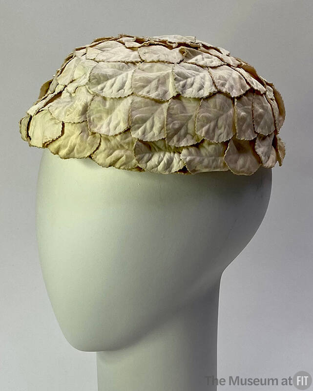 round hat made of overlapping white fabric petals