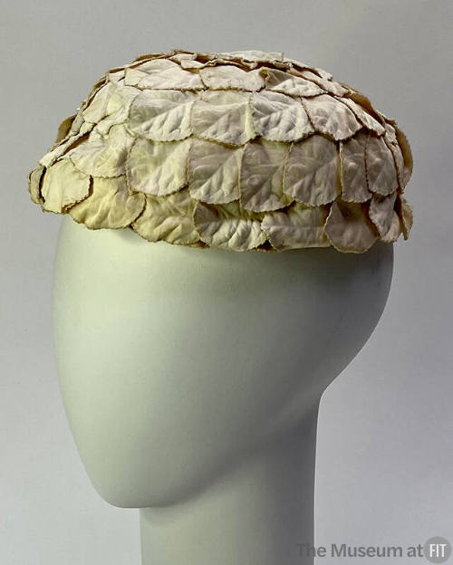 round hat made of overlapping white fabric petals