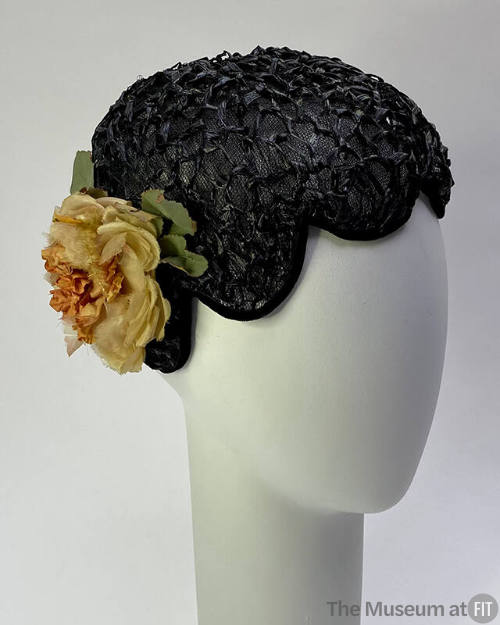 Black straw beret with scalloped edge; pink silk rose at side