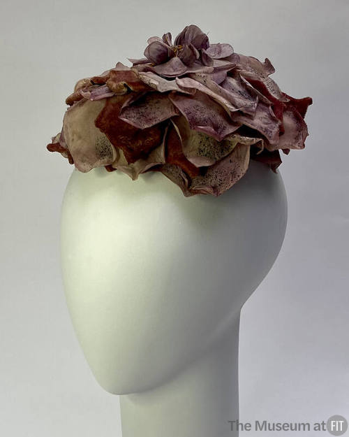 Small hat of large purple silk rose 