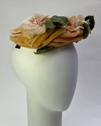 Pink velvet hat with pink silk roses and green leaves