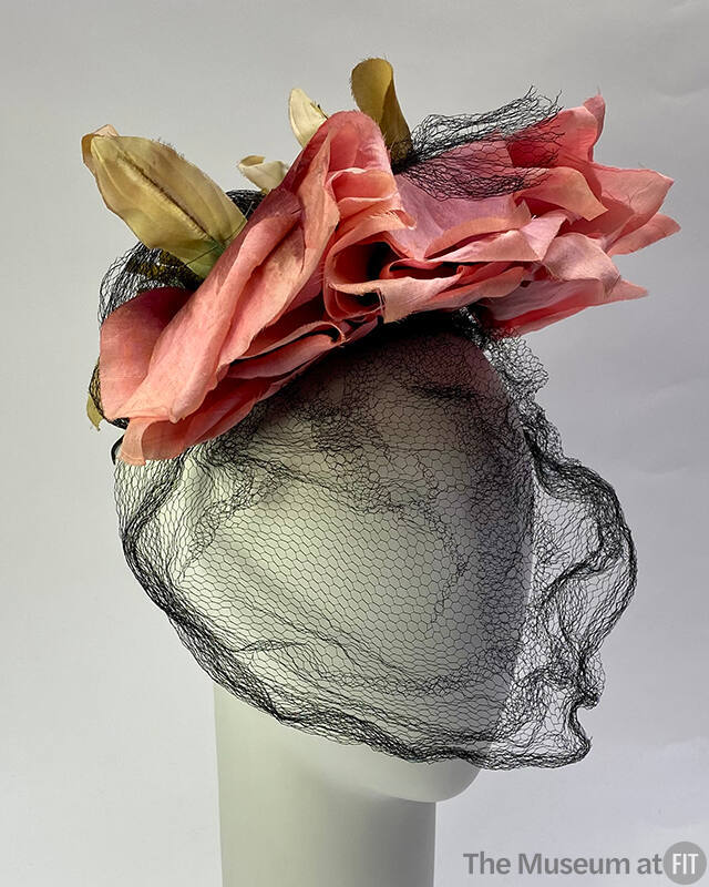 Small hat of pink roses with black face veil