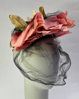 Small hat of pink roses with black face veil