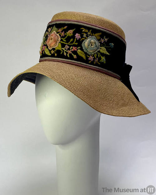 Straw hat with large black and multicolor floral embroidered hat band