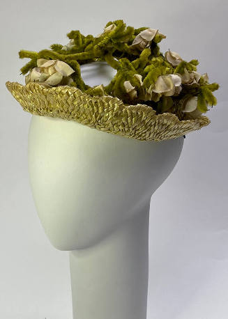 Light green straw hat iwth off-white artificial flowers