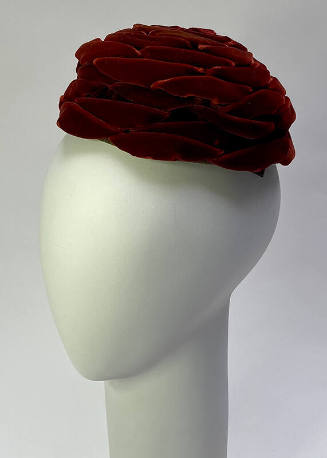 Red velvet hat with layered petal sections 