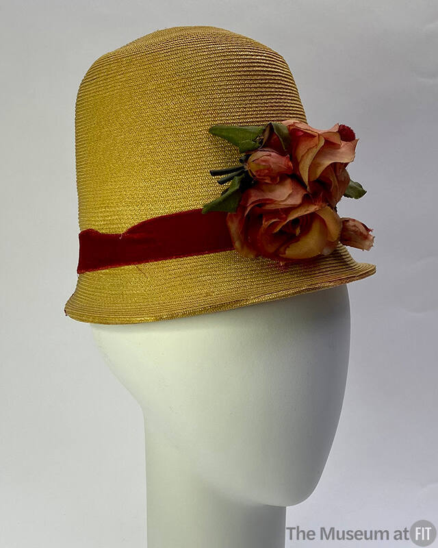 Straw high crown with red velvet ribbon band and silk rose at front