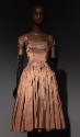Orange silk dress with short sleeves and knee-length fully gathered skirt