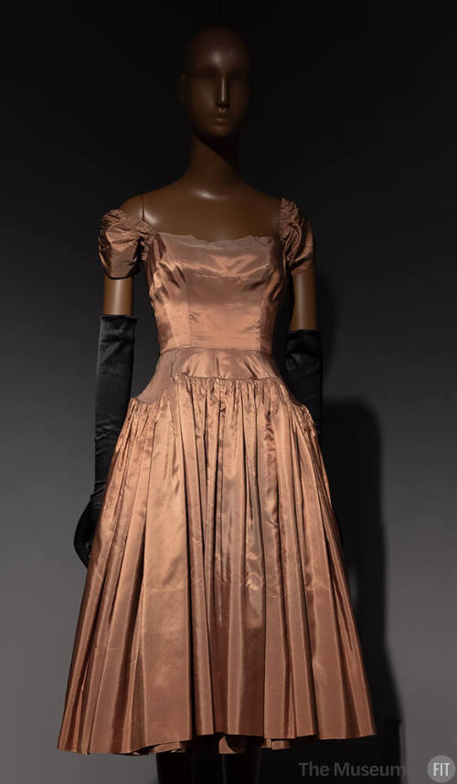 Orange silk dress with short sleeves and knee-length fully gathered skirt