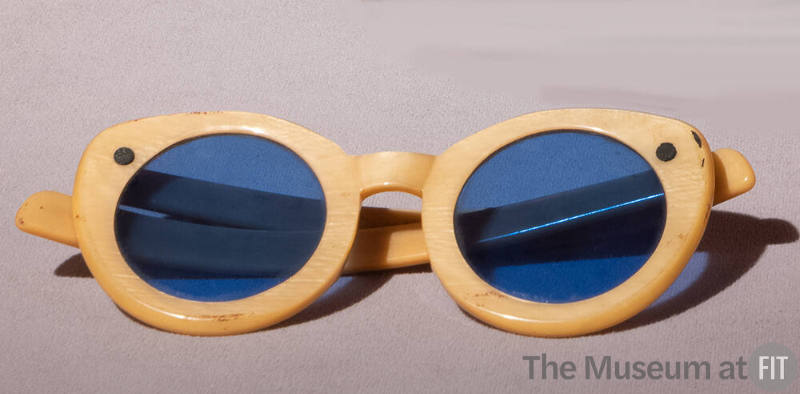 Yellow rounded cat eye sunglasses with bright blue lens
