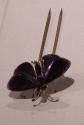 Purple glass butterfly hat pin with gold metal accents and double prong