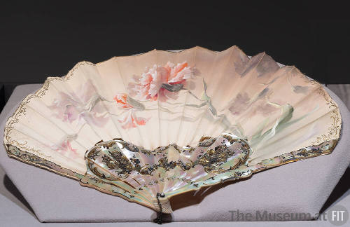 Cream fan painted with pink and purple carnations and mother-of-pearl sticks