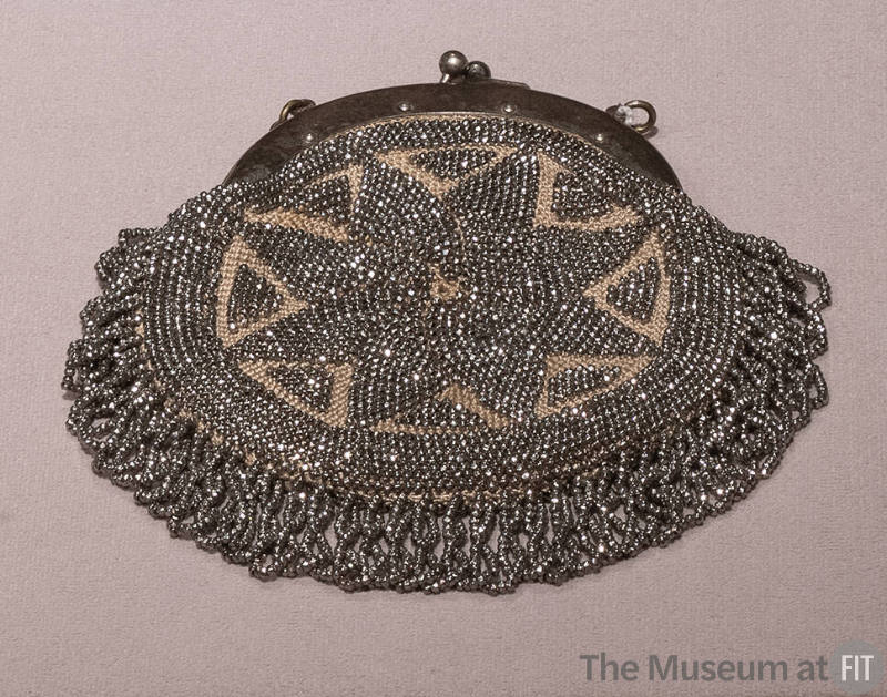 Round steel beaded bag with flower motif and silver frame