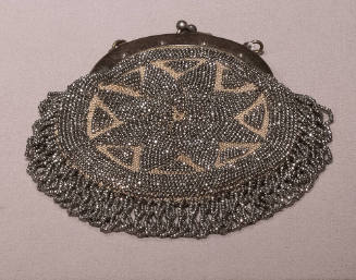 Round steel beaded bag with flower motif and silver frame