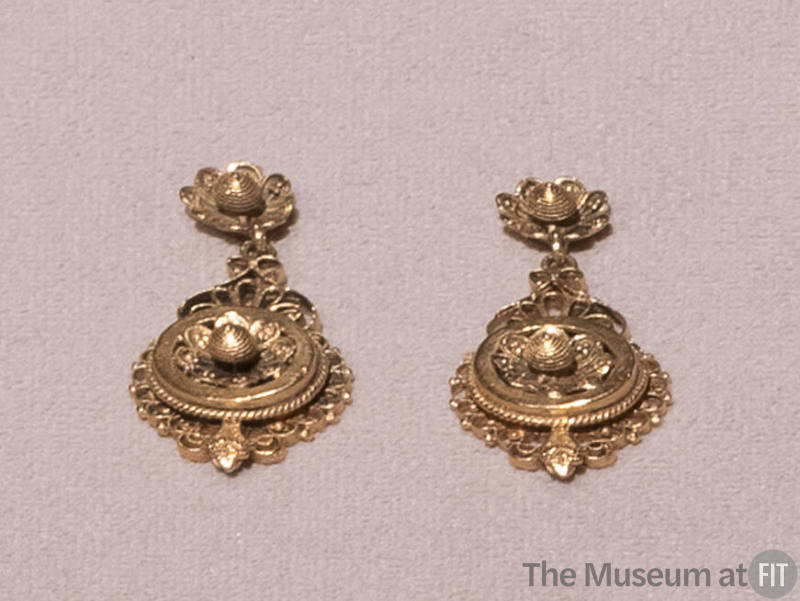 Pair of gold filigree dangle earrings with matching floral motif on post and lower dangle, surr…