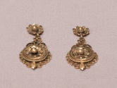 Pair of gold filigree dangle earrings with matching floral motif on post and lower dangle, surr…