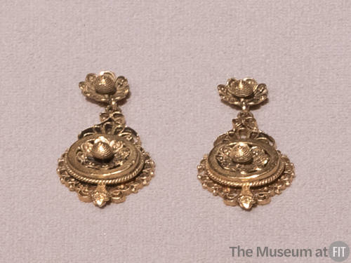 Pair of gold filigree dangle earrings with matching floral motif on post and lower dangle, surr…