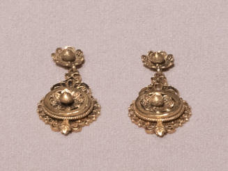 Pair of gold filigree dangle earrings with matching floral motif on post and lower dangle, surr…