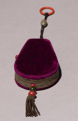Purple velvet hard case bag with orange finger ring, gold braided trim and beads