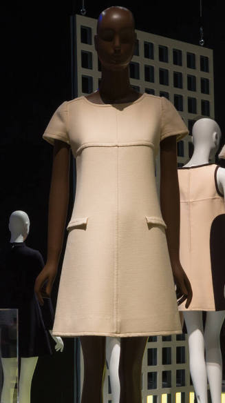 White short sleeved dress with wide round neck and faux pockets 