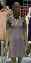 Navy blue and white knit mini dress with short sleeves and white collar with three buttons on V…