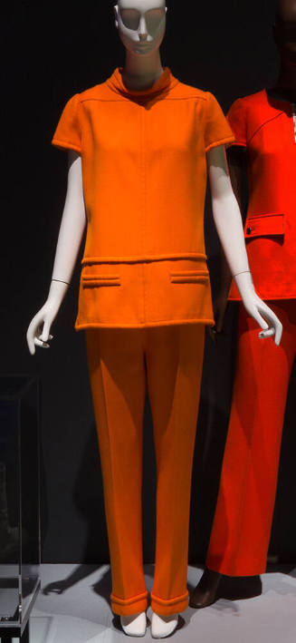 Orange twill suit with short sleeved top, matching flared pants with cuffed bottons