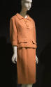 Orange wool 3/4 top with collar and front flap pocket and matching skirt