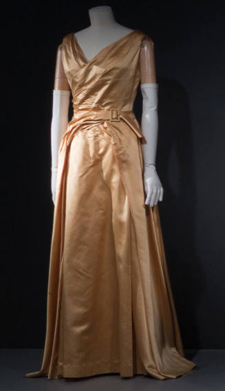 Pale gold sleeveless evening gown, v-neck front and drapoed front panel