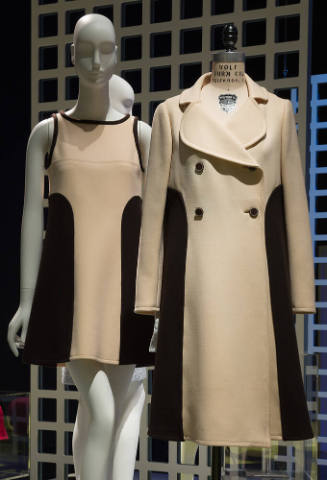 Left: beige sleeveless mini dress with black trim and side panels Right: matching beige double-…