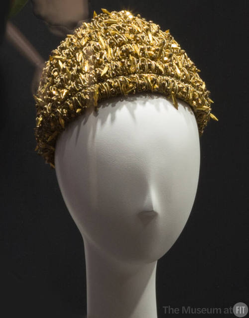 Metallic gold hat made of wrapped bullion cord and embellished overall with stones, beads and c…