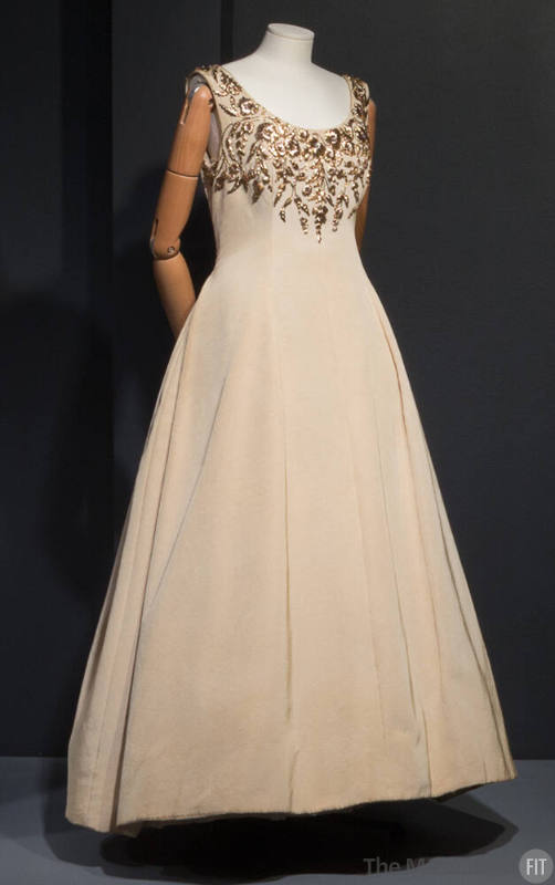 Beige silk sleeveless dress with gold floral embroidery at round neckline and bust, floor lengt…