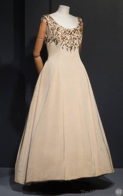 Beige silk sleeveless dress with gold floral embroidery at round neckline and bust, floor lengt…