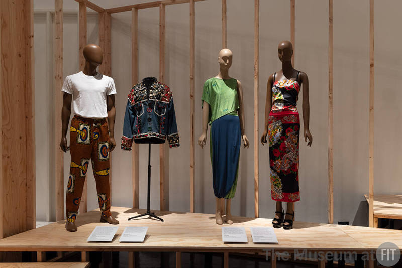A detail of the Global Wardrobe section. From left to right, designs by Comme des Garçons, Beau McCall, Han Feng, and Dolce and Gabbana. 
