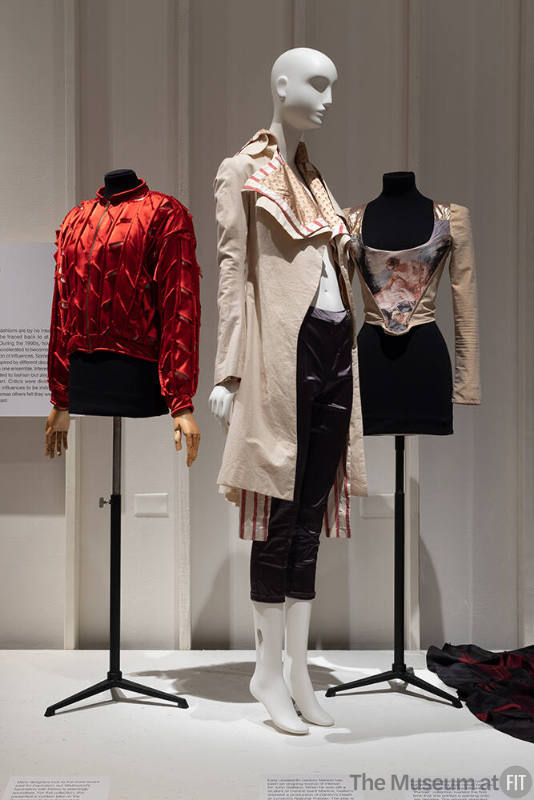 A detail of the Retro Revivals section, featuring clothing by Vivienne Westwood (far left and far right), and John Galliano (center). 