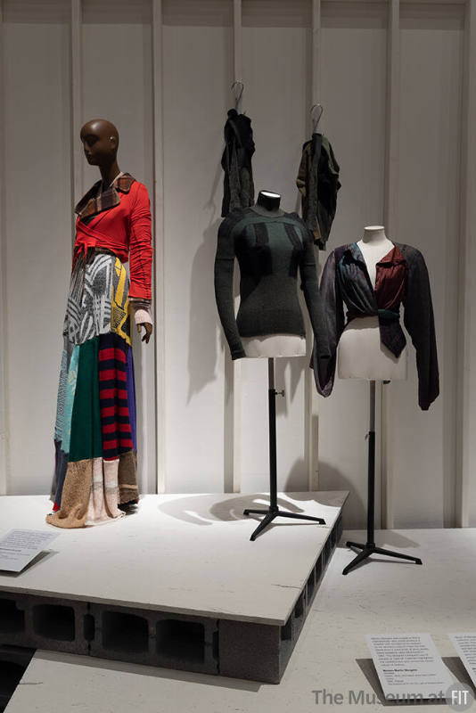 A detail of the Environmentalism and Reuse section, featuring designs by XULY.Bët (left) and Maison Martin Margiela (center and right).