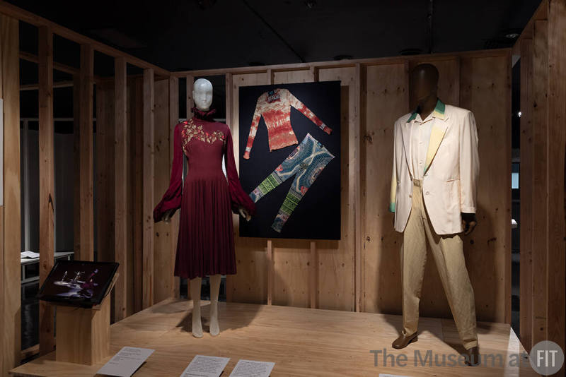 A detail of the Runway Shows section in the introduction to Reinvention and Restlessness: Fashion in the Nineties. From left to right: clothing by Alexander McQueen for Givenchy, Jean Paul Gaultier, and Matsuda. 