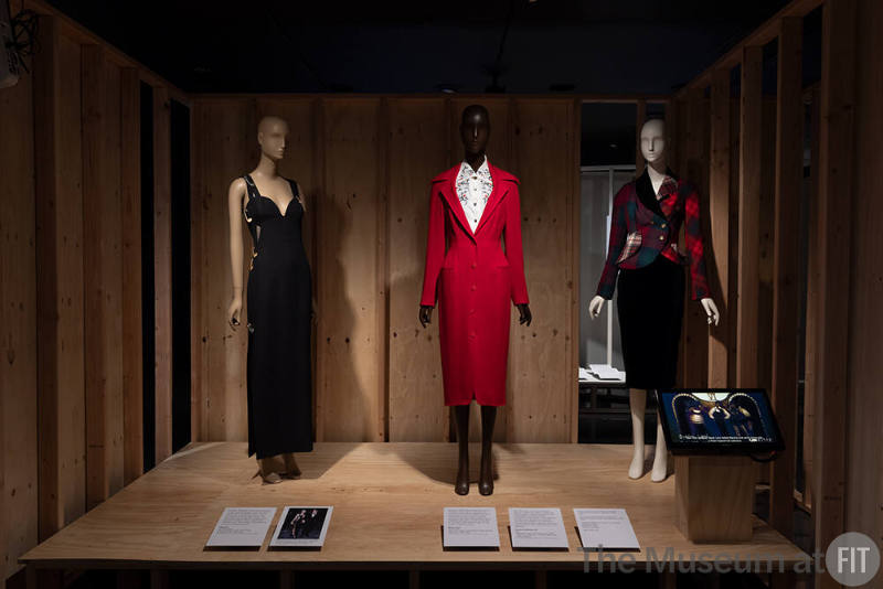 A detail of the Runway Shows section in the introduction Reinvention and Restlessness: Fashion in the Nineties. From left to right: clothing by Versace, Byron Lars, and Vivienne Westwood. 