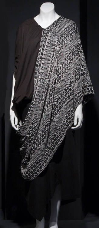 Black short sleeve top with white net poncho style overlay