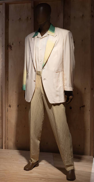 Man’s off-white jacket with yellow and green collar, right lapel and left sleeve, matching butt…