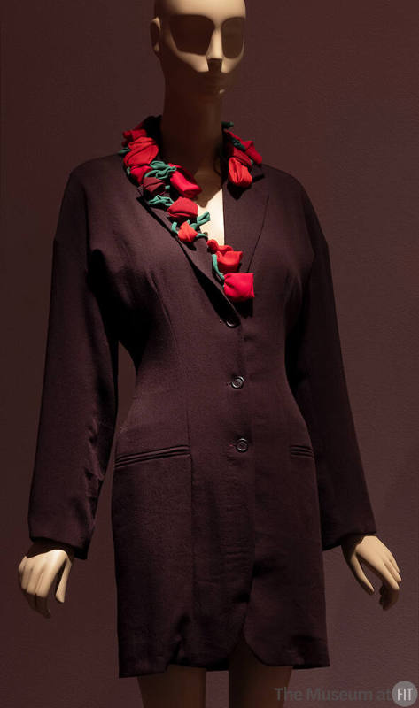 Dark red above the knee coat dress with jacket styling and red and green roses on collar and le…