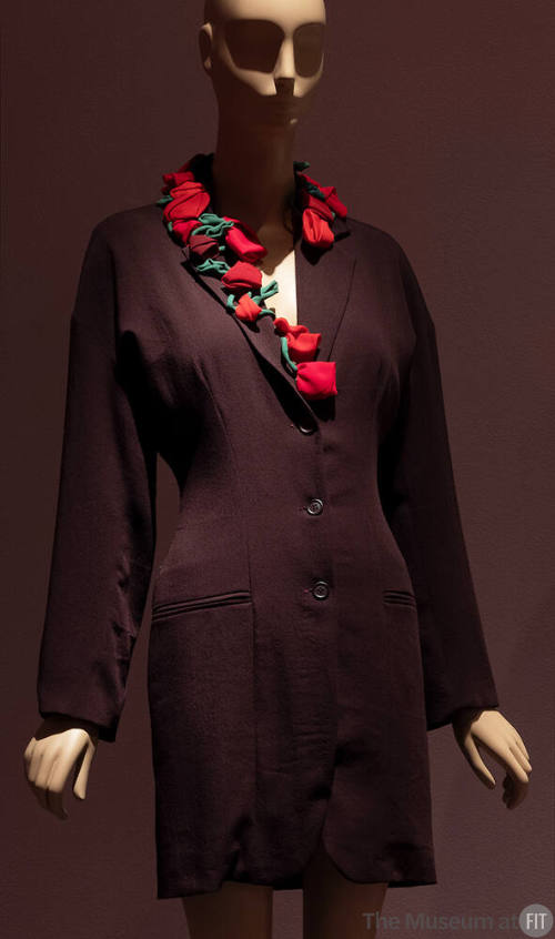 Dark red above the knee coat dress with jacket styling and red and green roses on collar and le…