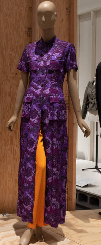 Purple floor length coat dress with abstract lotus print, short sleeves, patch pockets on eithe…