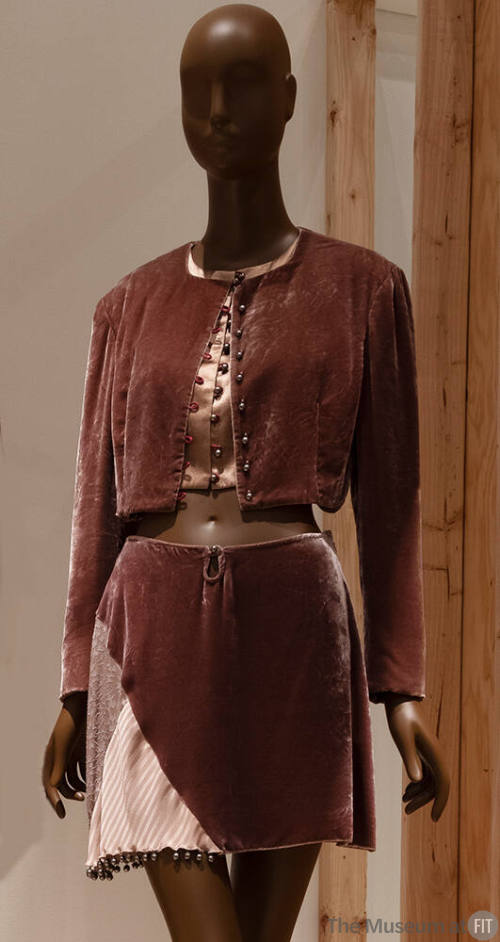 Pink velvet cropped long sleeve jacket with pink satin top and matching mini skirt