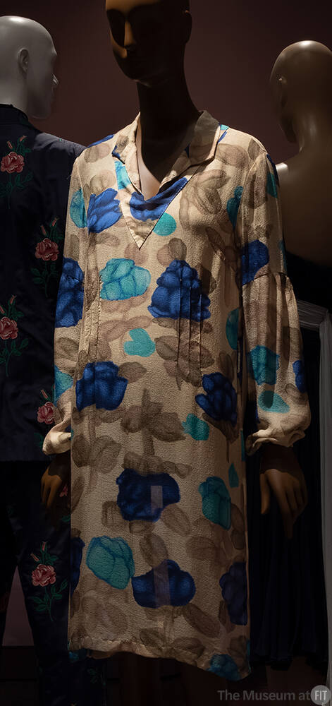 Beige long sleeve silk below-the-knee dress with light and dark blue floral print 