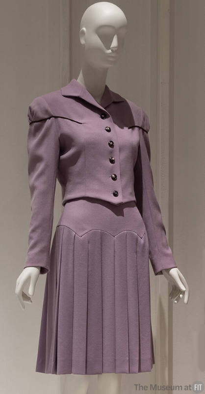Purple long sleeve button front jacket, purple to-the-knee pleated skirt