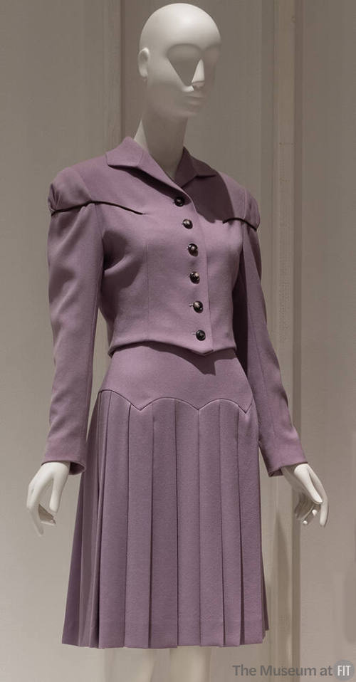 Purple long sleeve button front jacket, purple to-the-knee pleated skirt