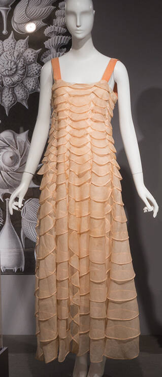 Floor length evening dress of pink overlapping semi-circles with pink camisole shoulder straps