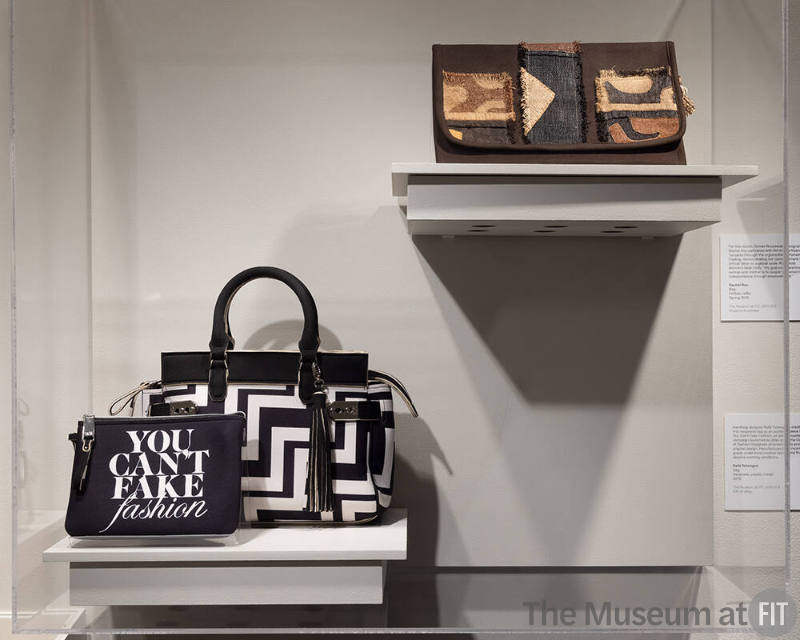 Close-up view of Rafé Totengco bag and Rachel Roy clutch in the Labor section of the exhibition.