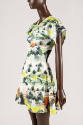 Short sleeve dress with Korean landscape print in shades of green, orange, and black 
